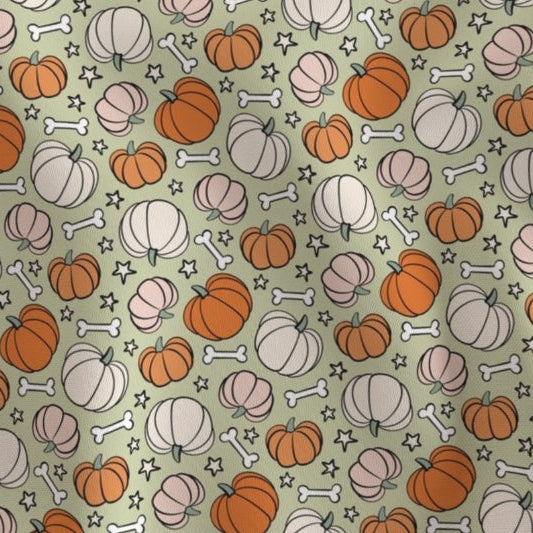 Pattern of pumpkins and bones on a green background